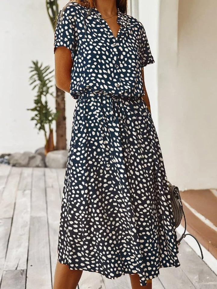 Model wearing the Brenda summer dress in brown colorway showing the flattering full-length silhouette