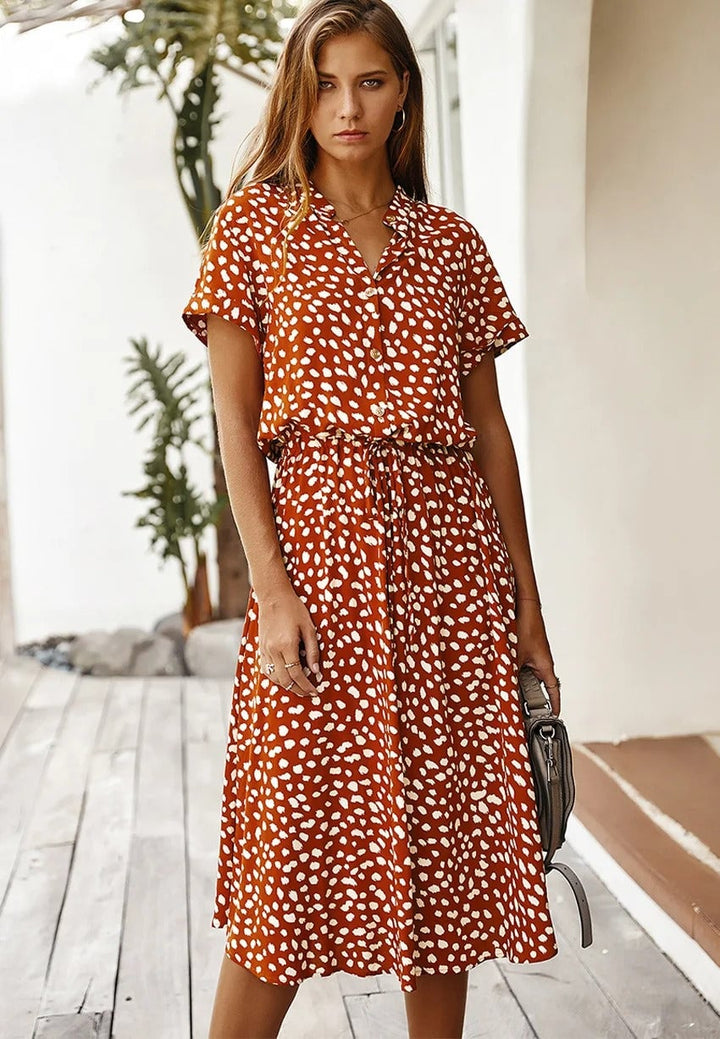 Model wearing the Brenda summer dress in green colorway with a relaxed and breezy fit