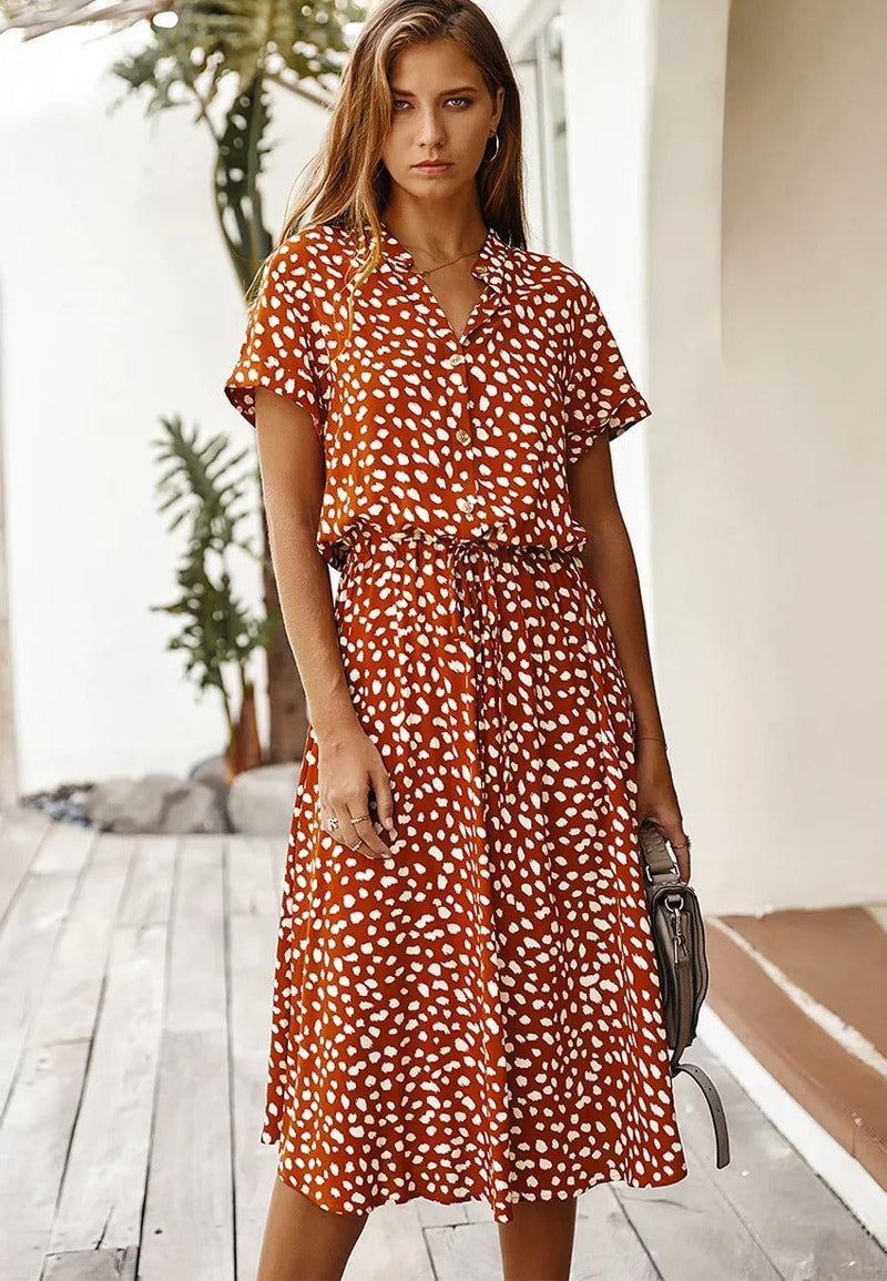 Model wearing the Brenda summer dress in green colorway with a relaxed and breezy fit