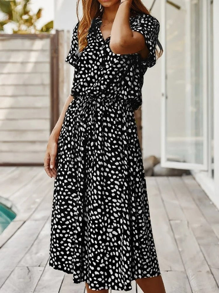 Model wearing the Brenda summer dress in khaki colorway showing the easy slip-on style