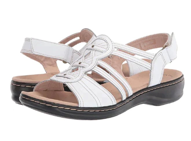 Briar women's cushioned sandals in white showing lightweight sole and secure strap fit, side view