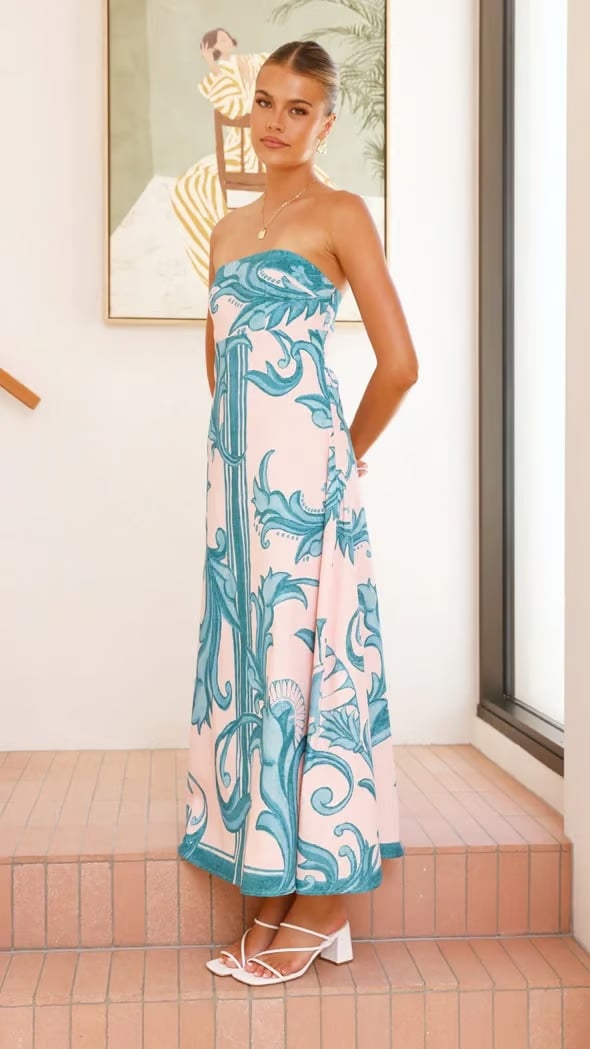 Back view of the Briar women's printed dress in blue showing the smooth tube-style design