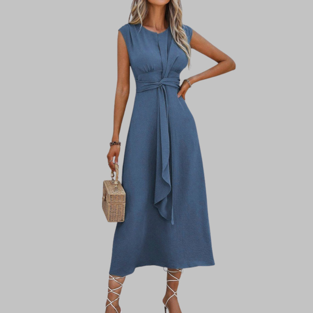 Full-length side profile of a lightweight sleeveless maxi dress with graceful drape