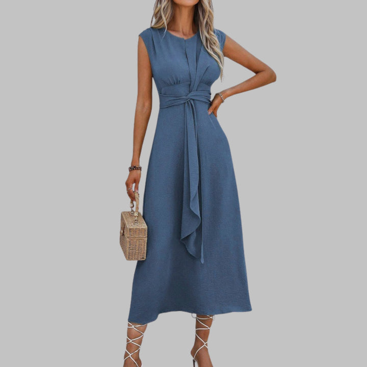 Full-length side profile of a lightweight sleeveless maxi dress with graceful drape