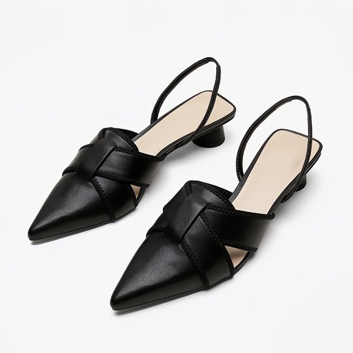 Bridgette women's low heel flat sandals in black with refined ankle straps, front view