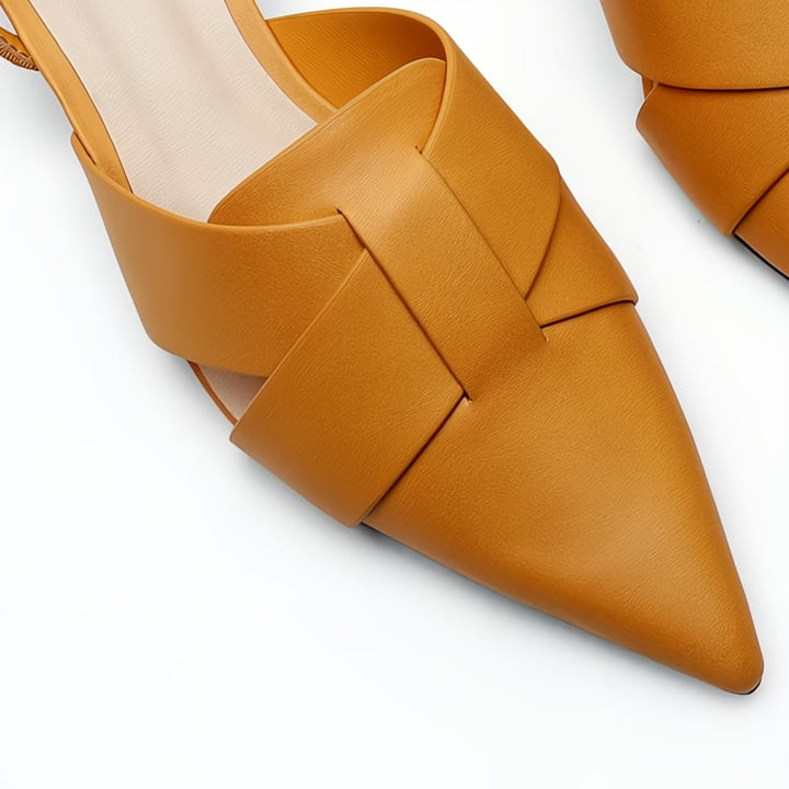 Bridgette low heel flat sandals in all three colors — black, beige, and orange — styled together