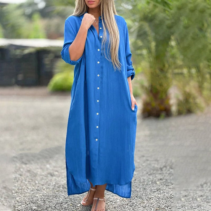 Close-up of the roll-tab sleeve and button detail on the Brielle white maxi shirt dress