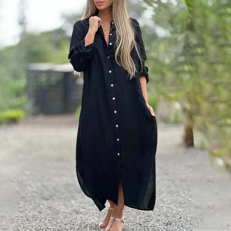 Side view of the Brielle maxi shirt dress in white highlighting the relaxed straight silhouette and front slit hem