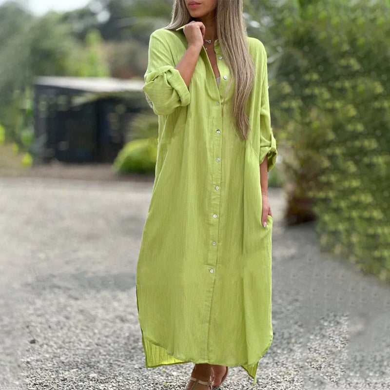 Woman wearing the Brielle maxi shirt dress in orange, belted at the waist with sandals
