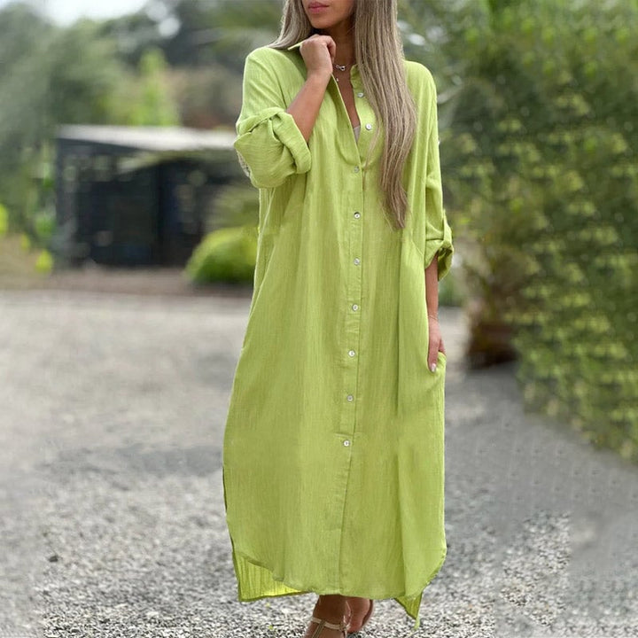 Woman wearing the Brielle maxi shirt dress in orange, belted at the waist with sandals