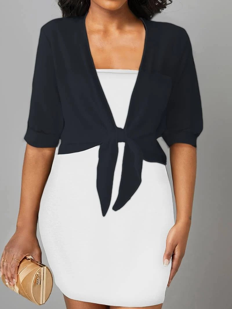 Front view of the Brisa sheer open-front blouse in white styled over a cami