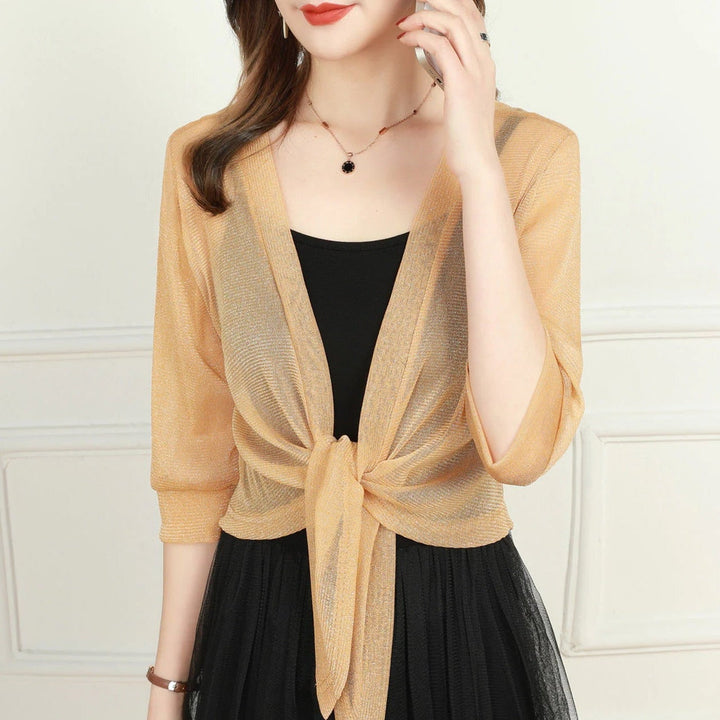 Woman wearing the Brisa sheer tie front blouse in red with 3/4 sleeves