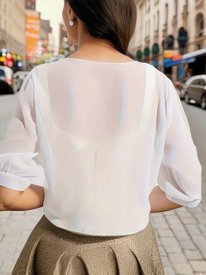 Front view of the Brisa open-front blouse in red styled over a neutral cami