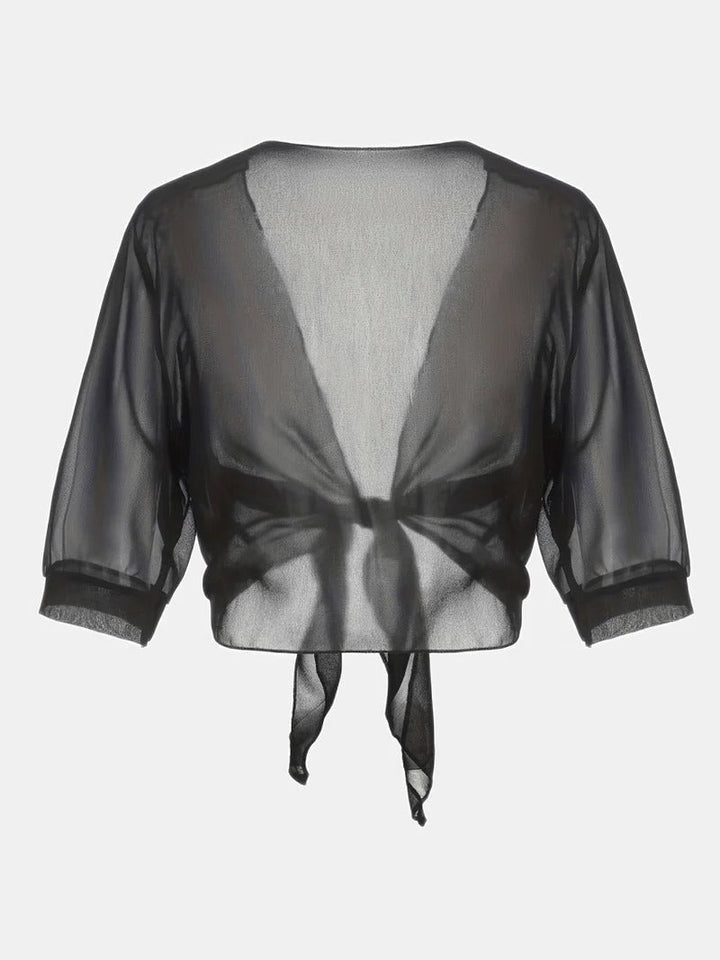 Front view of the Brisa open-front tie blouse in purple layered over a slip