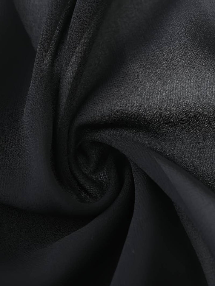 Side view of the Brisa lightweight blouse in purple showing the open-front silhouette