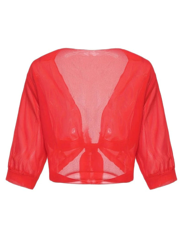 Front view of the Brisa open-front blouse in light blue over a white cami