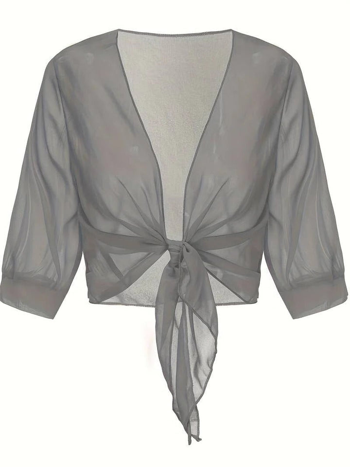 Front view of the Brisa open-front blouse in light gray layered over a cami