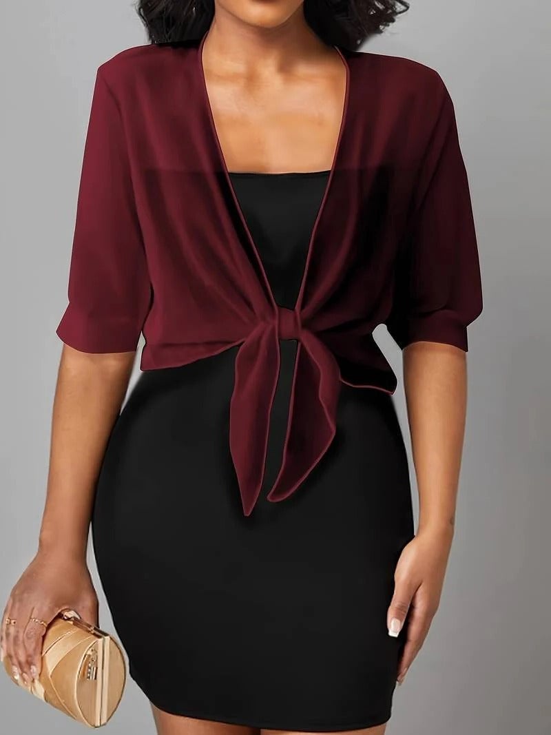 Front view of the Brisa open-front tie blouse in caramel styled over a slip dress