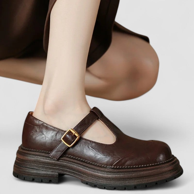 Top-down view of brown mary jane shoes highlighting rounded toe box and ankle strap