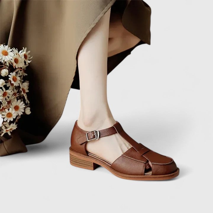 Brooke Mary Jane sandals in beige shown on a model's foot highlighting the subtle heel lift