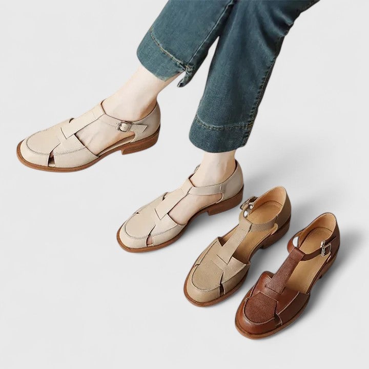 Brooke sandals in brown, three-quarter angle showing open cut-out silhouette