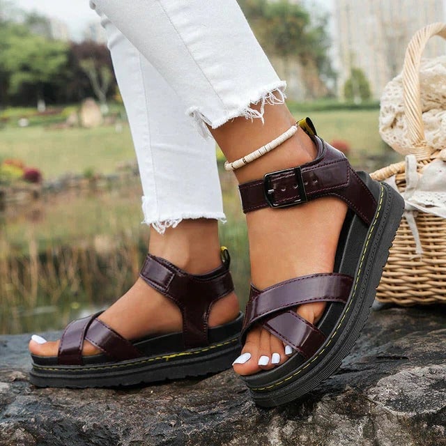 Brooke platform sandal showing adjustable ankle buckle closure and wide cross straps, side view