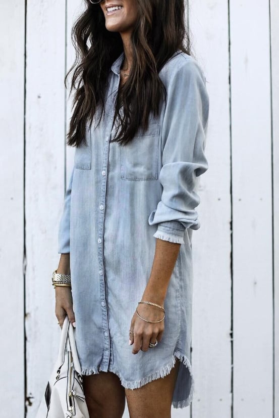 Woman wearing the Brooke casual shirt dress in black, paired with ankle boots for an everyday chic look