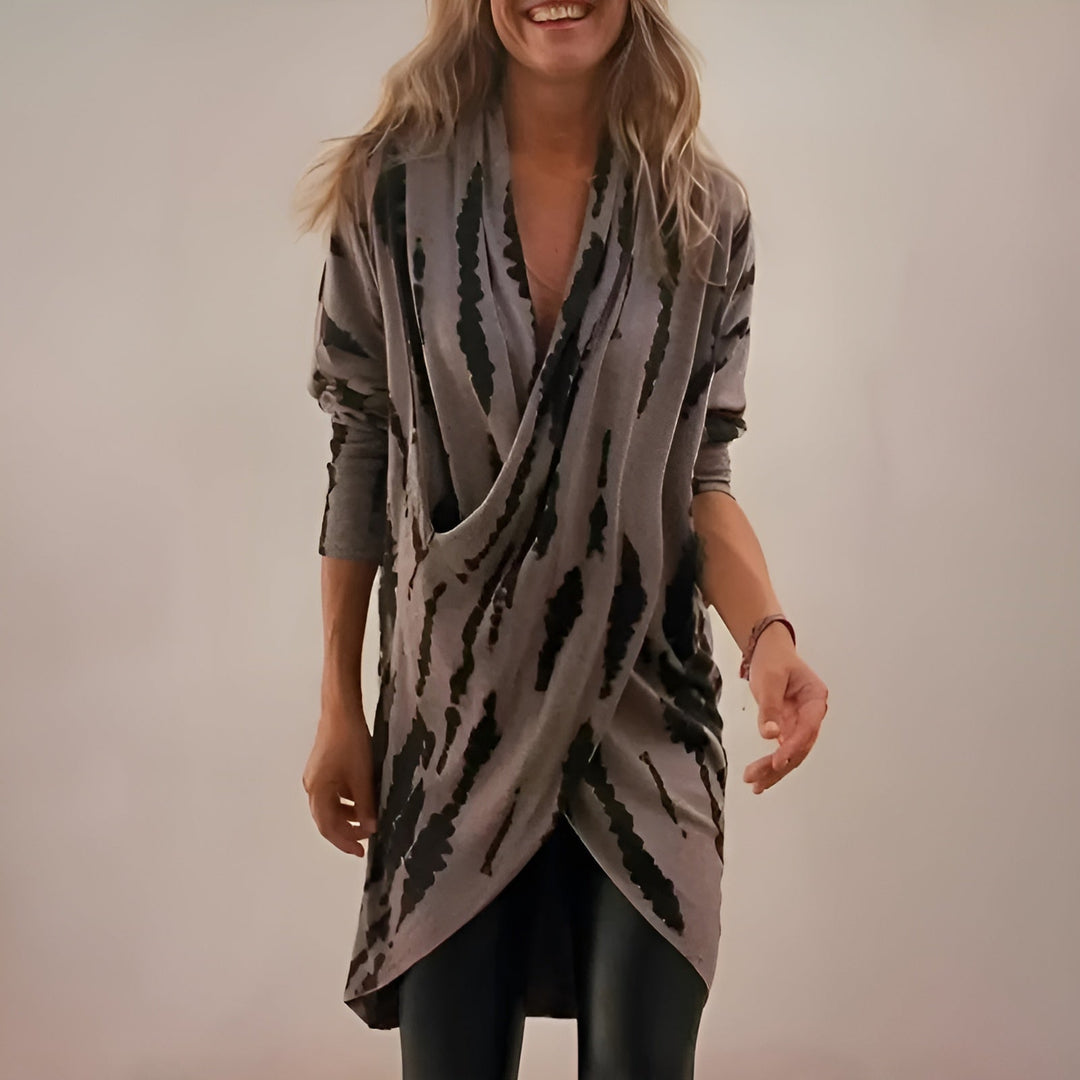 Woman wearing a soft gray V-neck tunic with a relaxed, flattering fit
