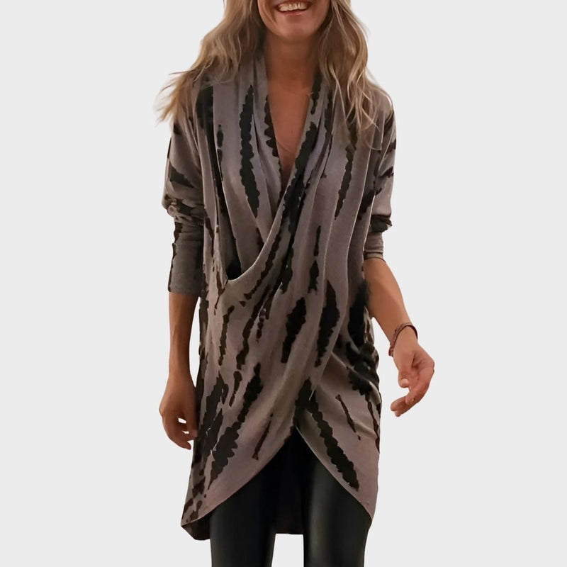 Gray V-neck tunic styled casually, shown from the front to highlight the relaxed silhouette