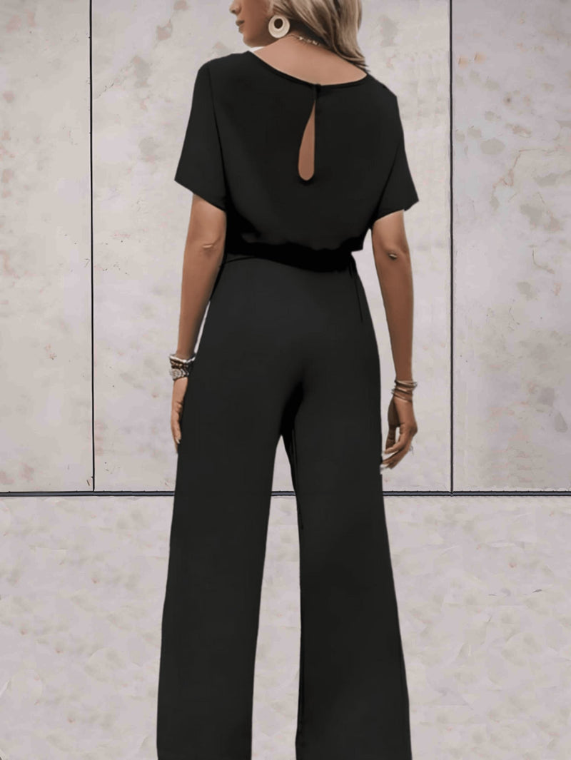 Close-up of the self-tie fabric belt on the Cali short-sleeve top in beige
