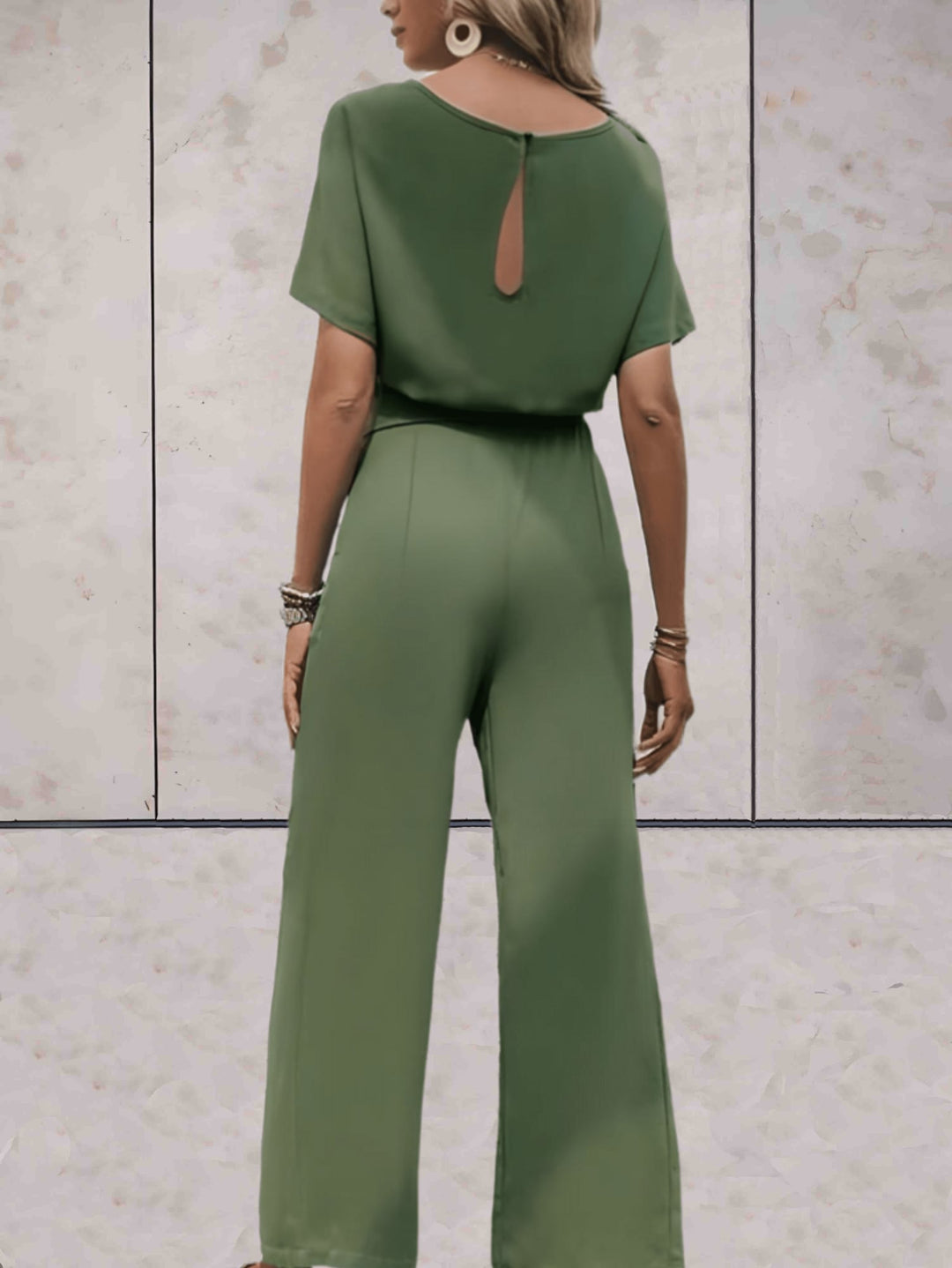 Flat lay of the Cali short-sleeve top and wide-leg pants in all three colors: black, beige, and green