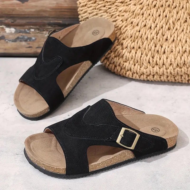 Calliope women's flat sandal in black, back heel view