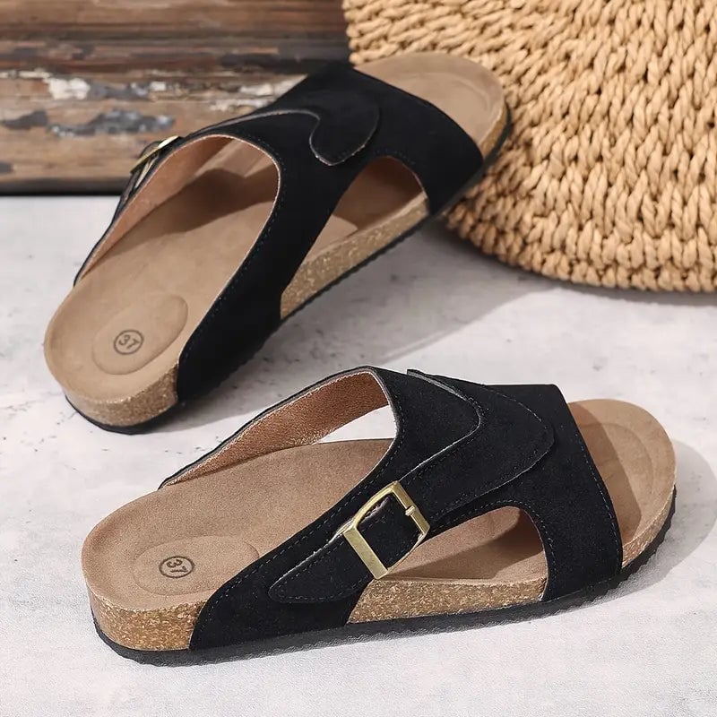 Calliope flat sandal in brown, front three-quarter view