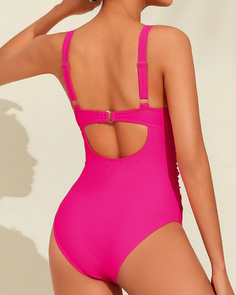 Close-up of the Calliope pink swimsuit fabric detailing its soft, stretchy texture