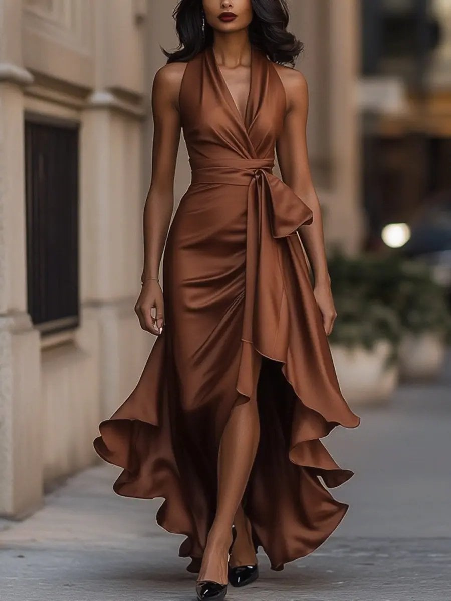 Woman wearing the Calliope halter neck maxi dress in burgundy at an evening event