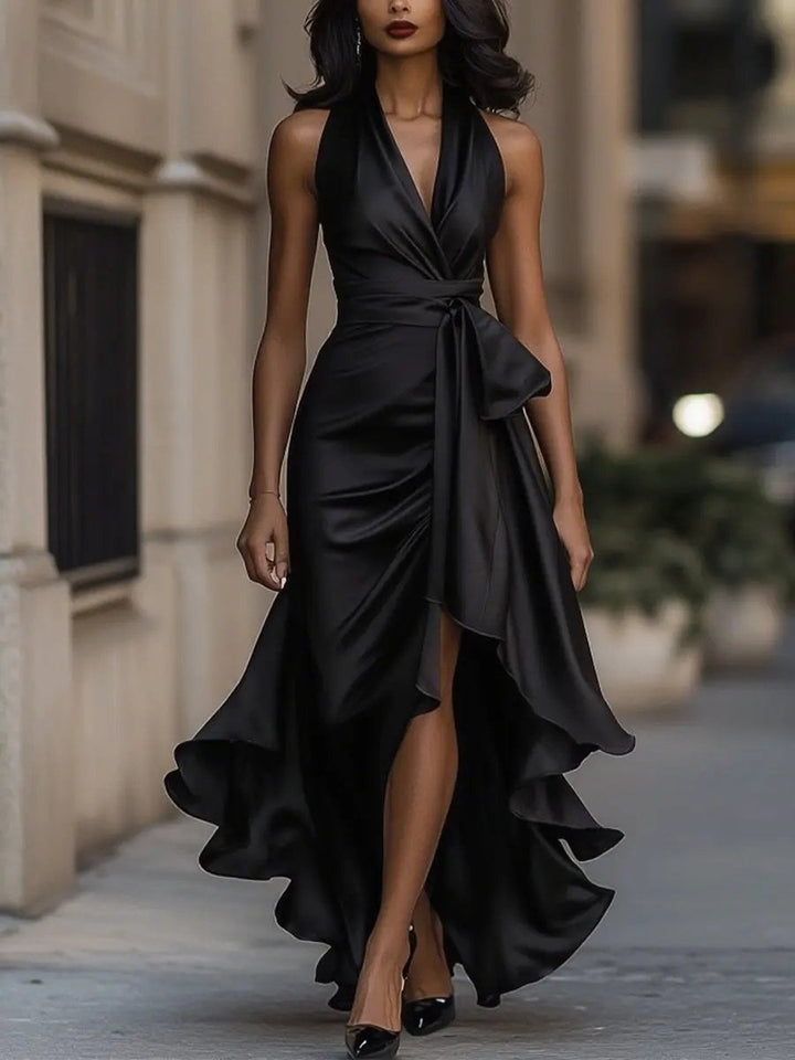 Overhead flat lay of the Calliope maxi dress in champagne showing the full silhouette and wrap waist