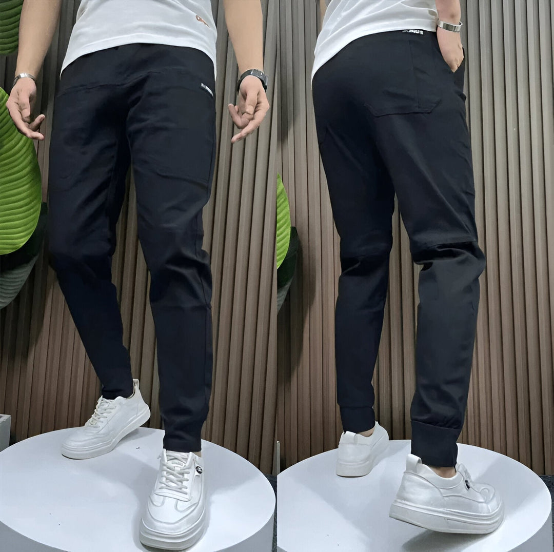 Front view of women's premium stretch cargo pants in a neutral color with side cargo pockets