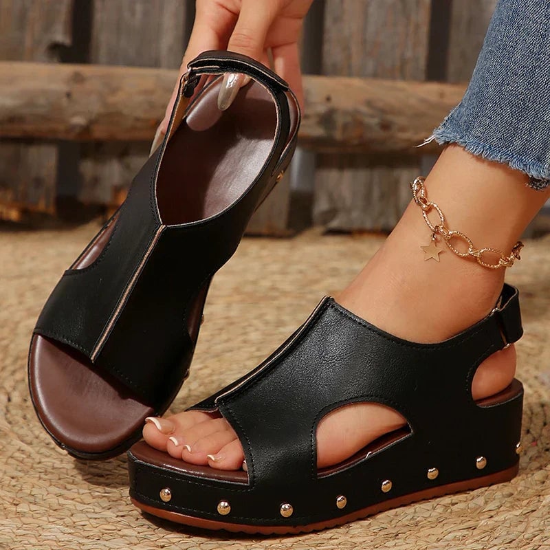 Camellia platform sandals in black, side profile highlighting cushioned footbed and platform height