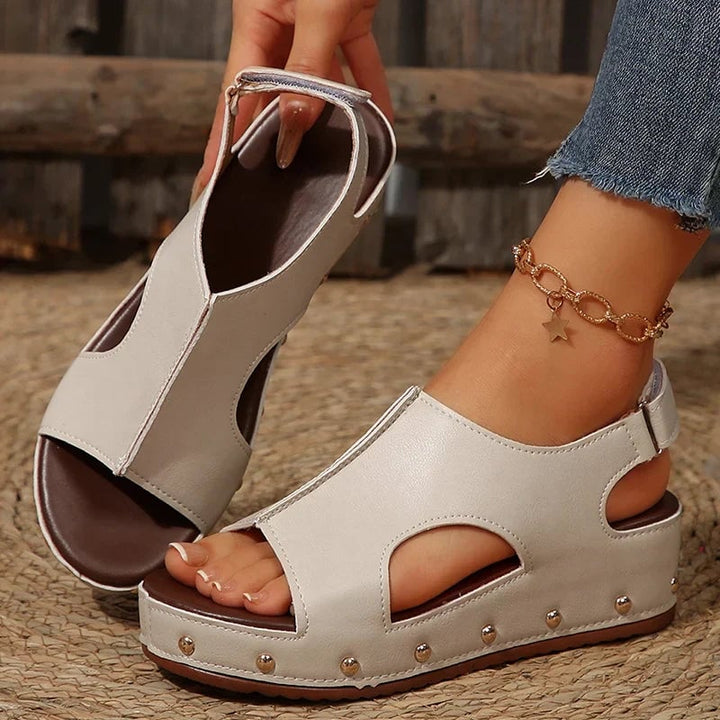 Camellia platform sandals in beige, styled on feet to show fit and platform lift
