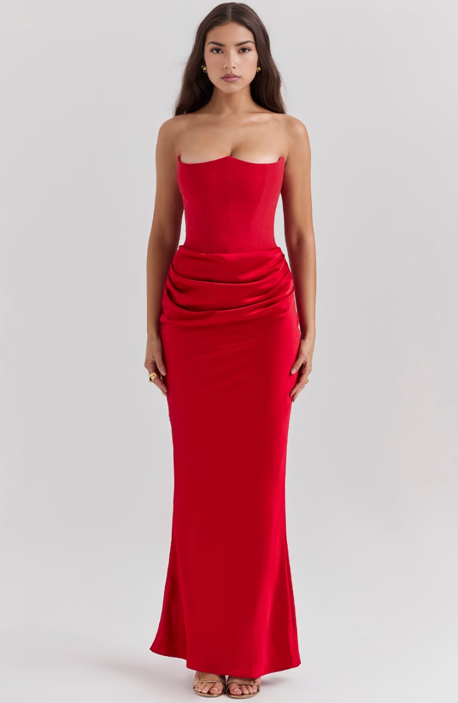 Back view of the Camellia strapless dress in Black showing the zip closure and flowing skirt