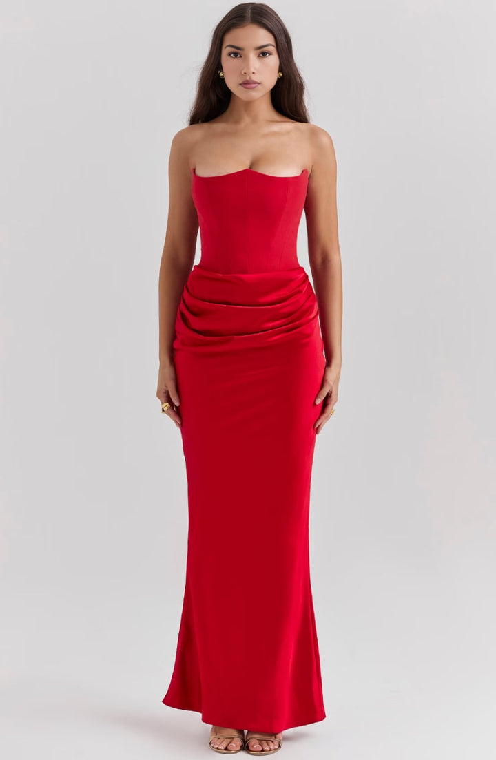 Back view of the Camellia strapless dress in Black showing the zip closure and flowing skirt