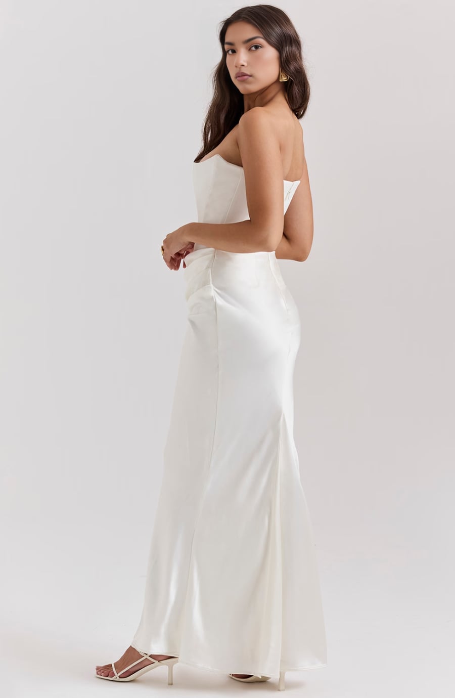 Back view of the Camellia dress in Pink showing the flowing skirt