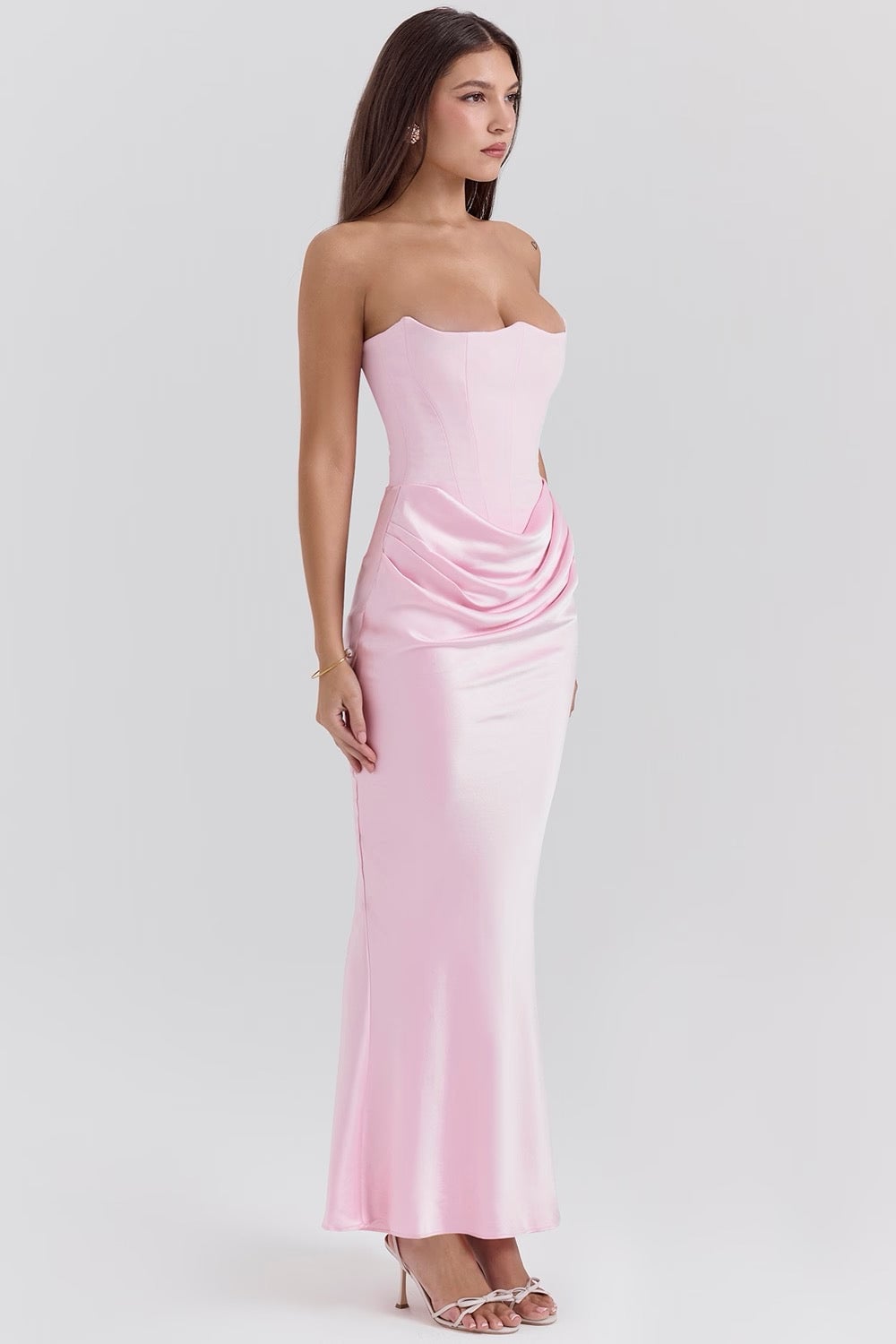 Back view of the Camellia dress in White showing the zip and flowing skirt