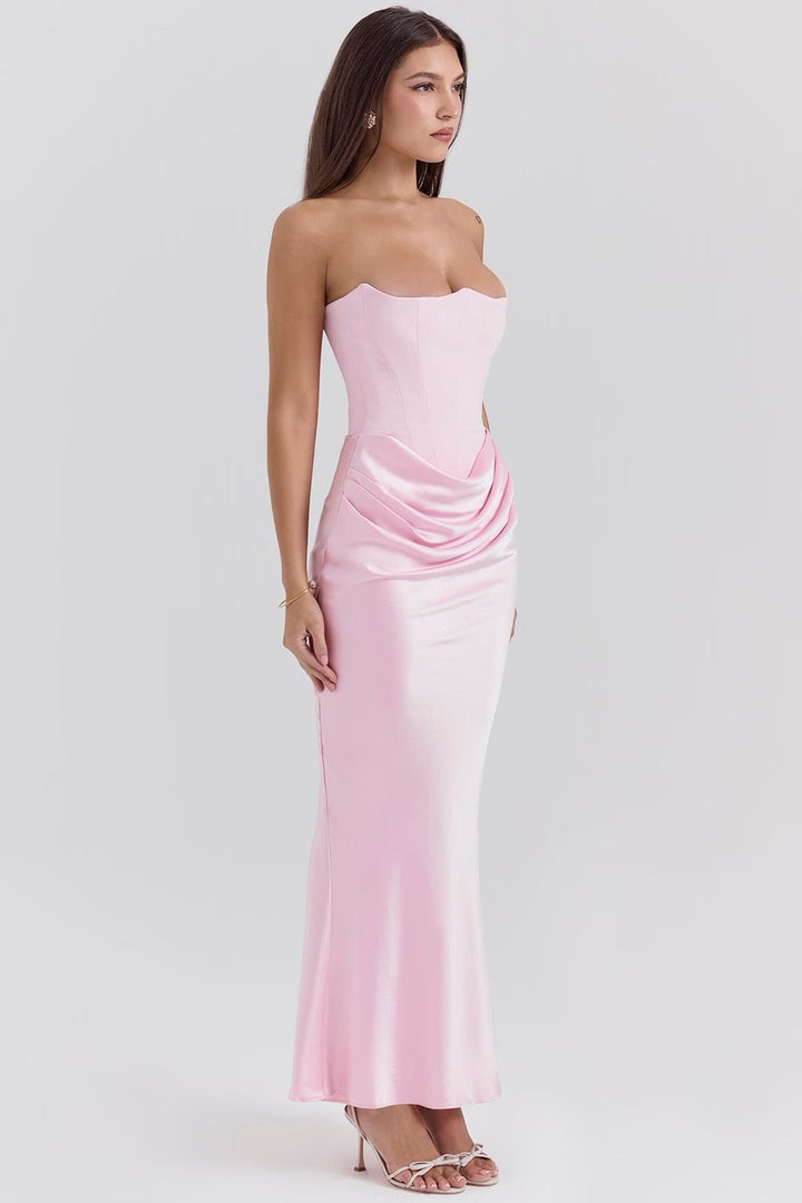 Back view of the Camellia dress in White showing the zip and flowing skirt