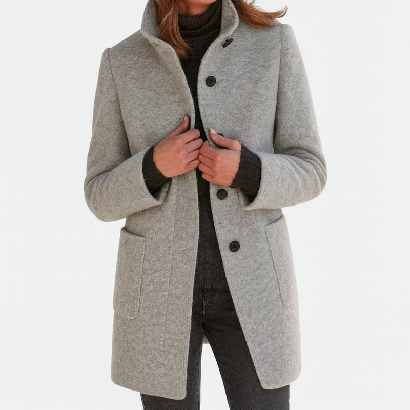 Woman wearing the Camila structured coat in a classic silhouette, styled for an elevated everyday look