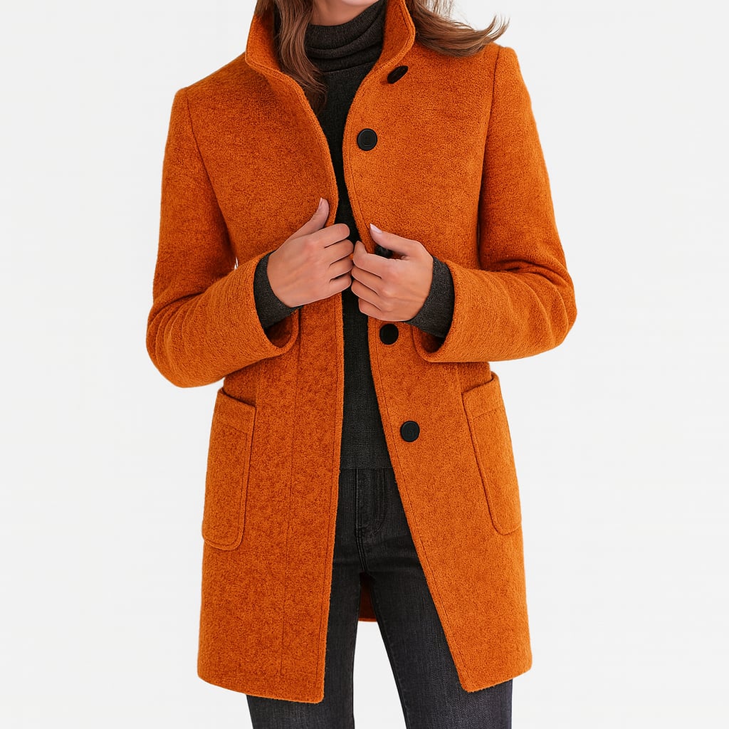 Camila coat in blue colorway displayed against a neutral background