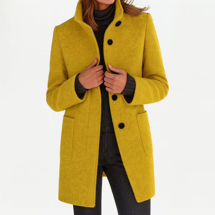 Camila coat in red colorway worn by a model, full-body styling shot