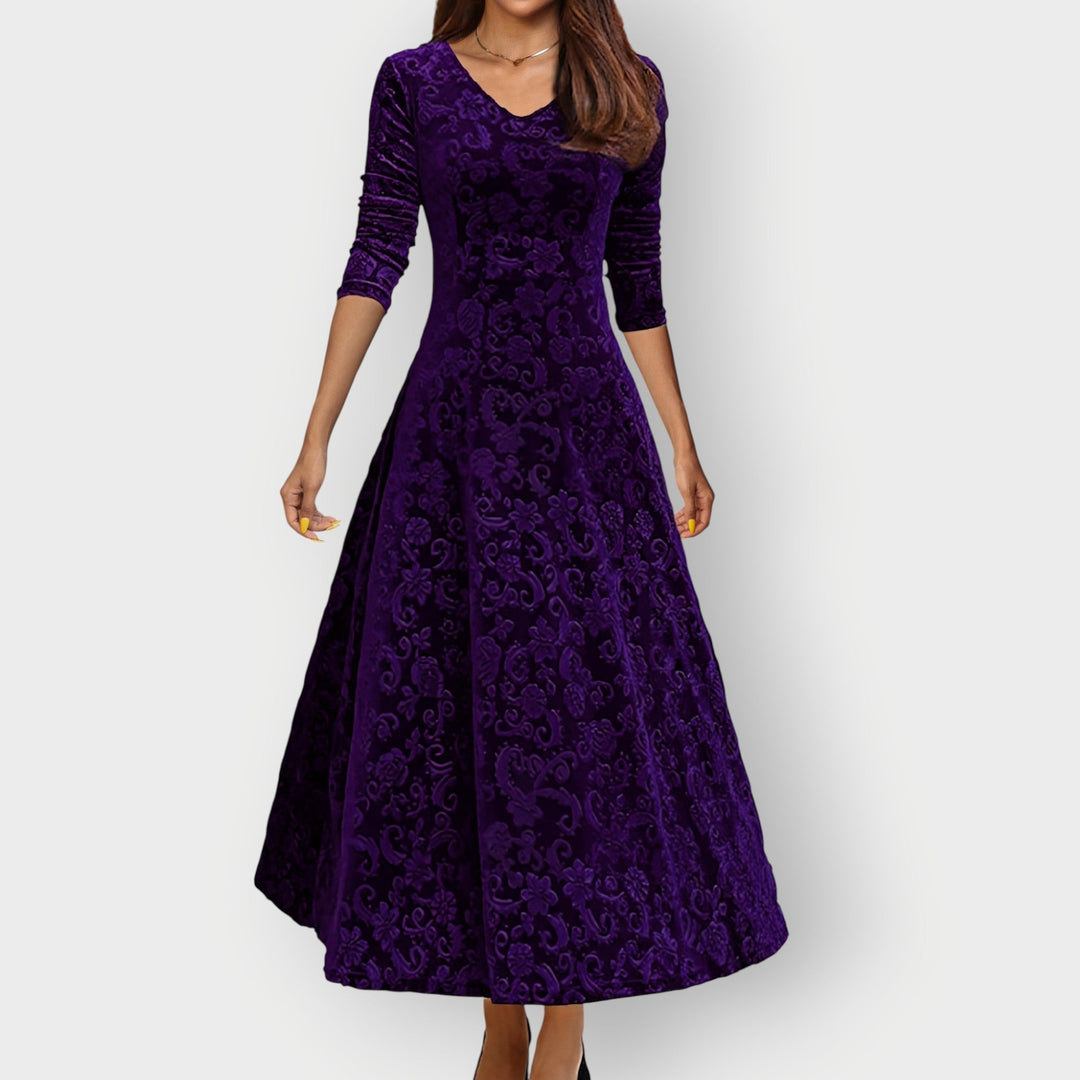 Back view of the Camila vintage velvet midi dress in emerald green showing smooth drape