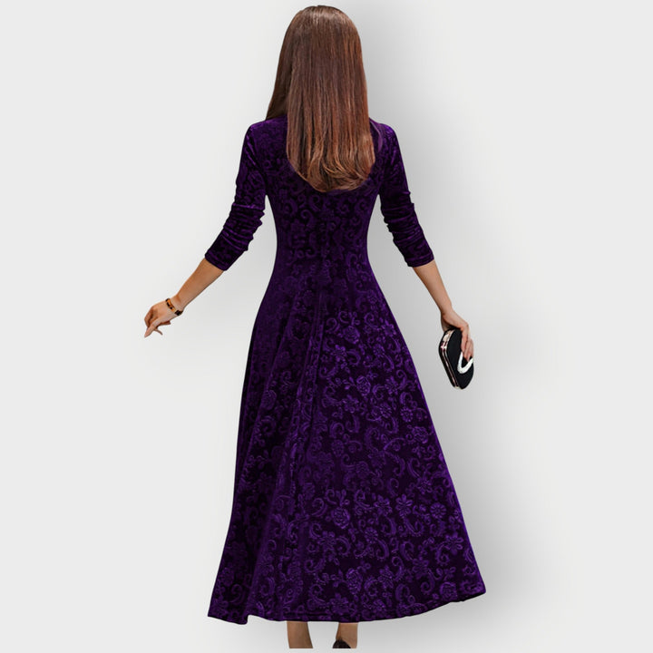 Woman in green velvet midi dress styled with heels for an evening occasion