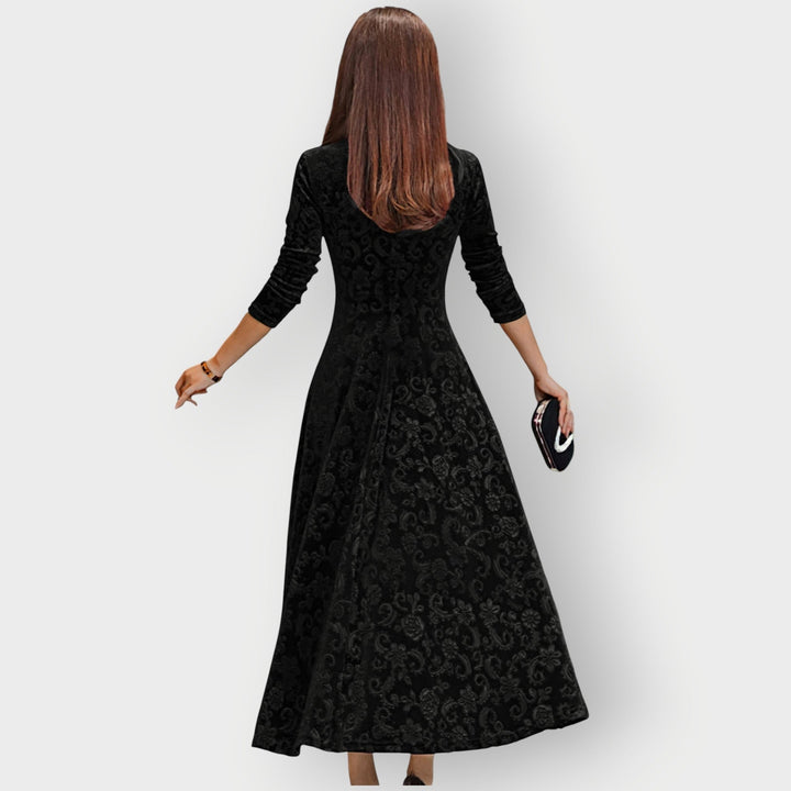 Detail shot of neckline and shoulder construction on the Camila velvet midi dress in navy blue